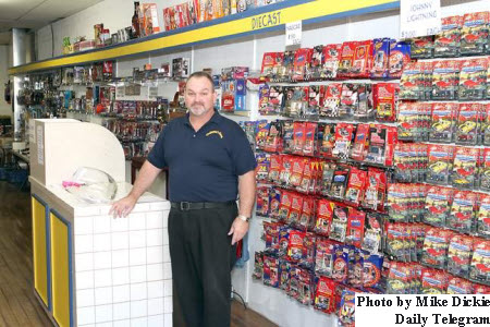 Matt Woznicki, owner of Collector's King, inside his shop on Main Street in Morenci, Michigan.